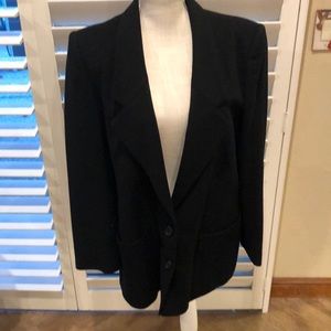 Classic black wool blazer. Fully lined. Two button closure. Soft to the touch.